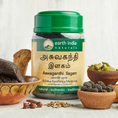 Photo of Aswaganthi Ilagam surrounded by its hearbal raw ingredients